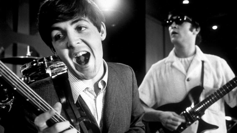 Paul McCartney and  John Lennon of rock group The Beatles rehearsing on stage during American tour. Photograph: Bob Gomel//Time Life Pictures/Getty Images.