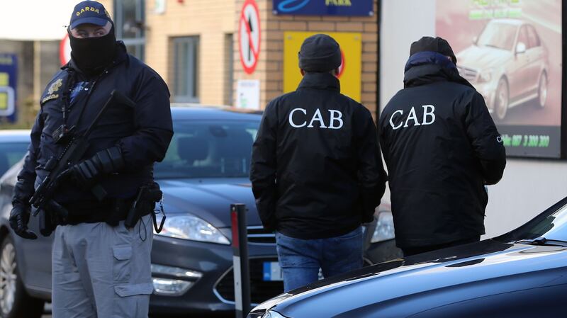 Members of the Criminal Assets Bureau at the scene of searches in Dublin on Wednesday morning. Photograph:  Niall Carson /PA Wire