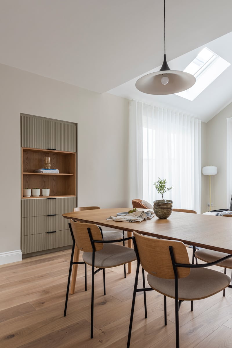 Open-plan space with recessed storage by Optimise Design