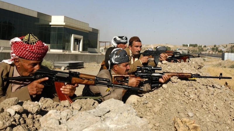 Ex-combatants of the Kurdish Peshmerga fighters who volunteered again to fight with Kurdish forces against the militants from the Islamic State, take up position near Khazer town near Mosul city, northern Iraq. Photograph: Mohammed Jalil/EPA