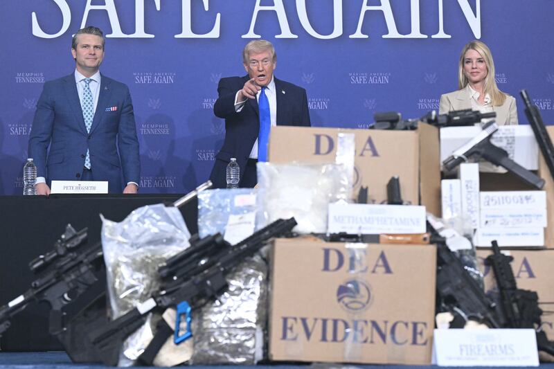 US president Donald Trump, flanked by US defence secretary Pete Hegseth and attorney general Pam Bondi, participates in his Memphis Safe Task Force anti-crime initiative roundtable in Memphis, Tennessee, on Monday. Photograph: Saul Loeb/AFP via Getty