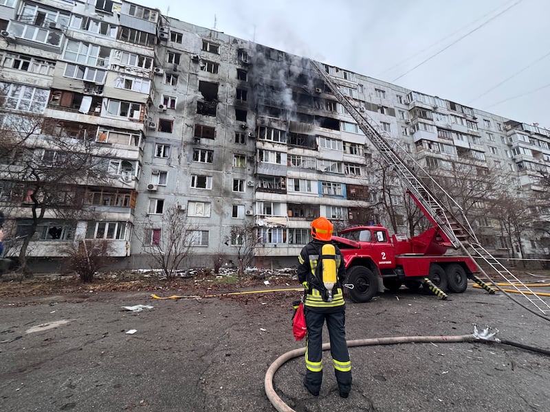 A firefighter looks at a damaged residential building following an air attack in Zaporizhzhia on December 16th, amid the Russian invasion of Ukraine. Photograph: Darya Nazarova/STR Zaporizhzhia/AFP via Getty