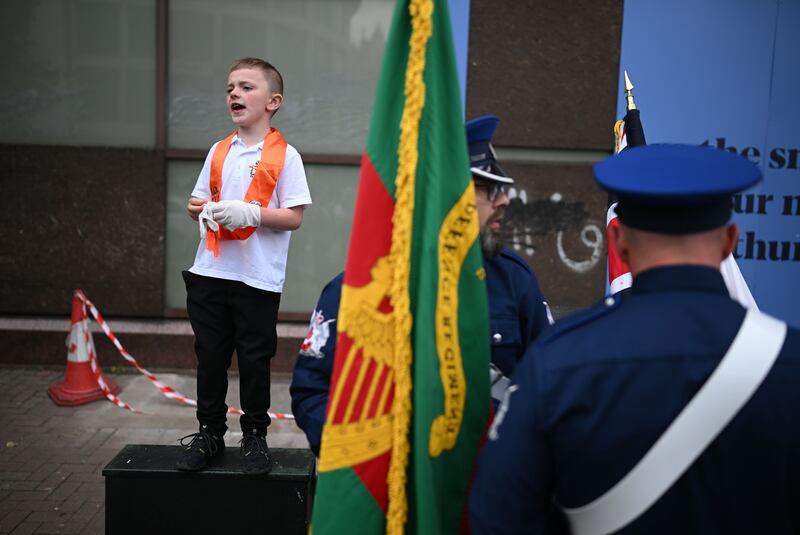 A young lodge member shouts his approval as Orangemen and band members take part in the parade in Belfast. Photograph: Charles McQuillan/Getty Images