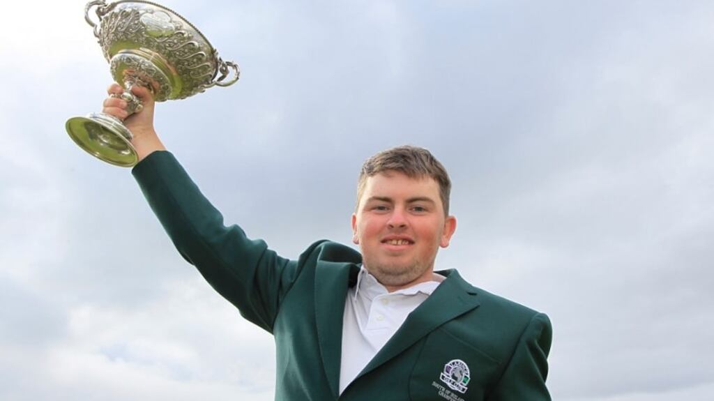 Caolan Rafferty holds aloft the trophy after winning the South of Ireland at Lahinch.
