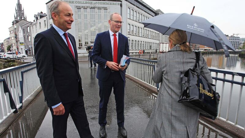 Fianna Fáil leader Micheál Martin and Tánaiste Simon Coveney  canvassing in Cork city on Monday morning for a Yes vote in the upcoming referendum. Photograph: Diane Cusack