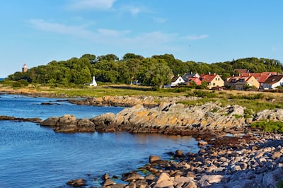 The rocky Baltic Sea coast of Svaneke on Bornholm island, Denmark. Photograph: Cortuum/Getty/Istock