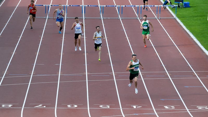 Barr crosses the line to win the 400m hurdles. Photo: Sam Barnes/Sportsfile