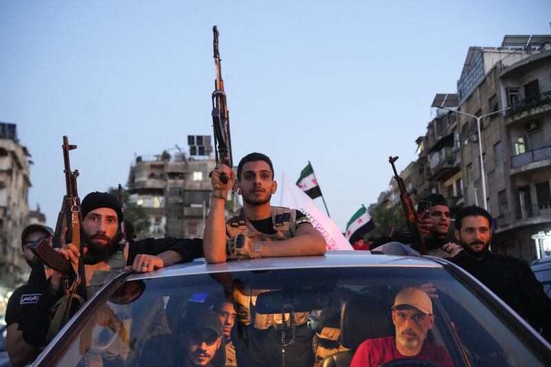 Syrian security forces ride a vehicle during a demonstration against Israeli intervention in Syria, in Damascus on Wednesday. Photograph: Rami Al Sayed/Getty Images