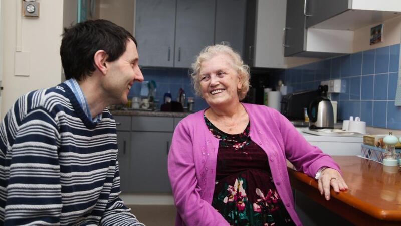 Paul Raymond, manager of the Irish Chaplaincy Service seniors project, talks to client Veronica Finney (79) in her flat in west London. She is  originally from Armagh.  Photograph: Joanne O’Brien