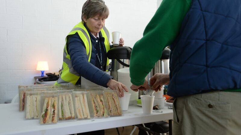 Staff prepare some food for service users at St Catherine’s sports hall in Marrowbone Lane, Dublin , where the  Dublin Region Homeless Executive and Peter McVerry Trust have set up emergency beds. Photograph: Dara Mac Dónaill