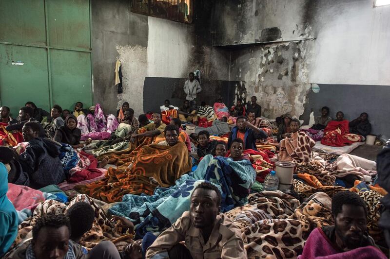 Migrants sitting in a packed room at the Tariq Al-Matar detention centre on the outskirts of the Libyan capital Tripoli. Photograph: Taha Jawashi/AFP via Getty Images
