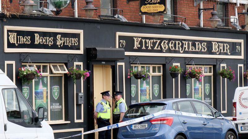 Gardaí at the scene at Fitzgerald’s Bar, Sexton Street North, Limerick City where  Patrick O’Connor was fatally stabbed. Photograph: Don Moloney / Press 22