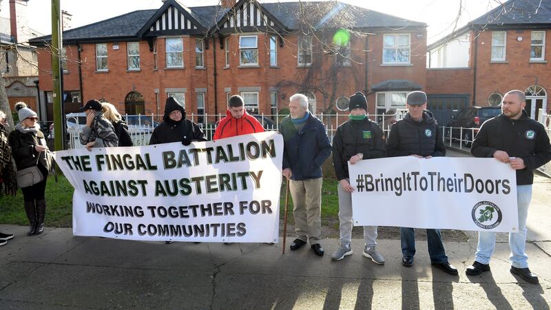 Members of the Fingal Battalion Against Austerity protest outside the home of Richard Bruton.  Photograph: Dara Mac Donaill/The Irish Times
