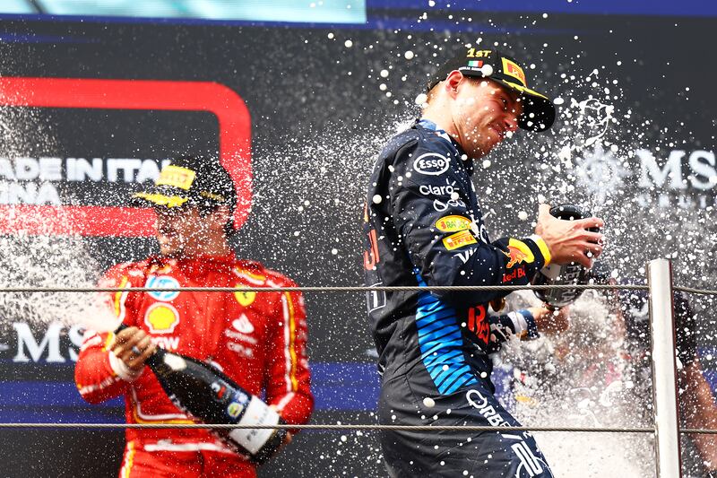 Max Verstappen celebrates on the podium after winning the Emilia-Romagna Grand Prix in Imola, Italy. Photograph: Mark Thompson/Getty Images