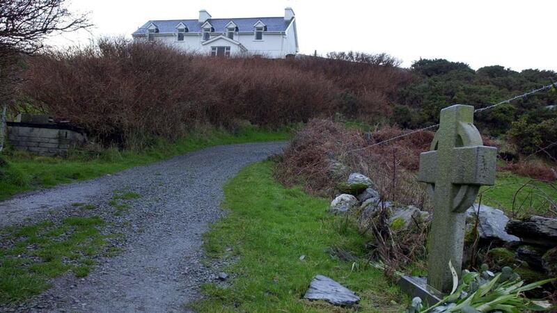 The former holiday home in Schull, Co Cork of Sophie Toscan du Plantier and the cross that marks the spot where she was found murdered. Photograph: Eric Luke