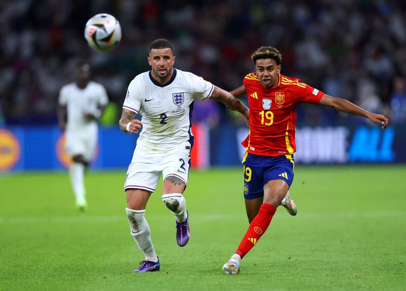 BERLIN, GERMANY - JULY 14: Kyle Walker of England and Ollie Watkins of England chase the loose ball during the UEFA EURO 2024 final match between Spain and England at Olympiastadion on July 14, 2024 in Berlin, Germany. (Photo by Lars Baron/Getty Images)