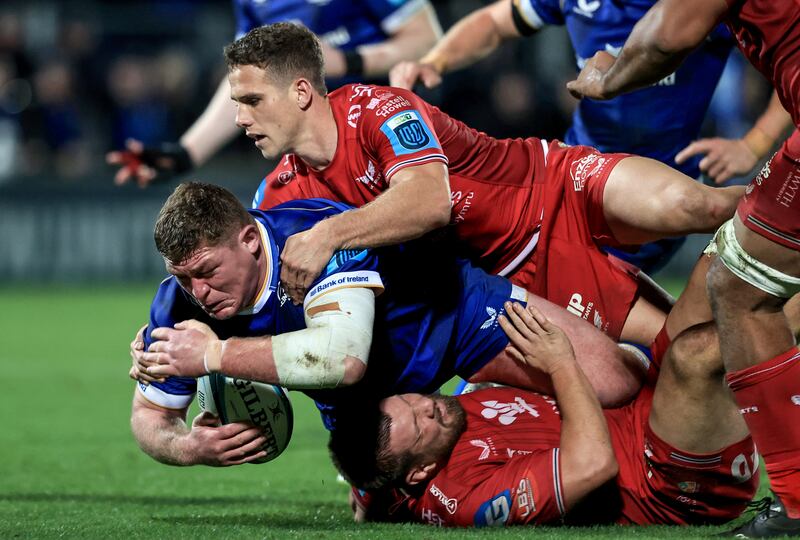 Leinster’s Tadhg Furlong is tackled by Kieran Hardy of Scarlets at the RDS. Photograph: Dan Sheridan/Inpho 