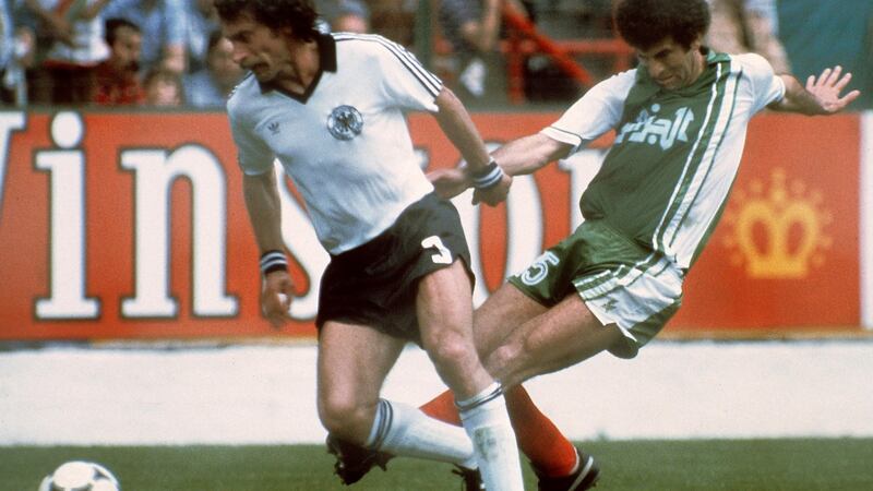 West German defender Paul Breitner  under pressure from Algerian midfiedler Mustapha Dahleb. Photograph: Staff/Getty