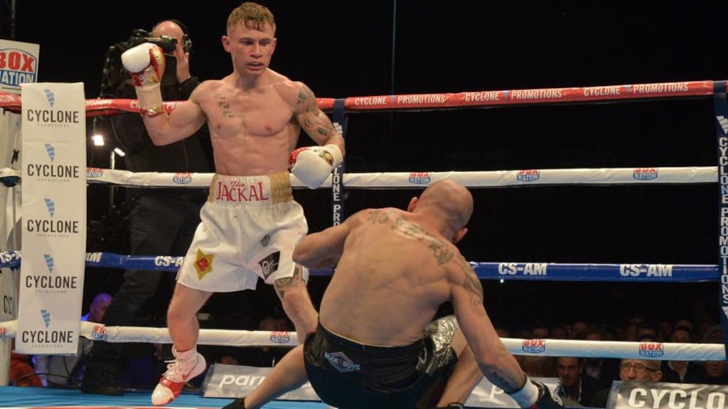 Carl Frampton of Northern Ireland knocks down Kiko Martinez of Spain during their IBF super-bantamweight world title bout. Photograph Charles McQuillan/Getty Images