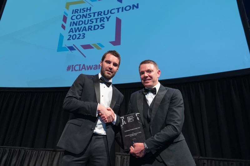 Shane Lannon, director and managing consultant, Lumen Search, presents the contractor project of the year award to Conor McMahon, Flynn