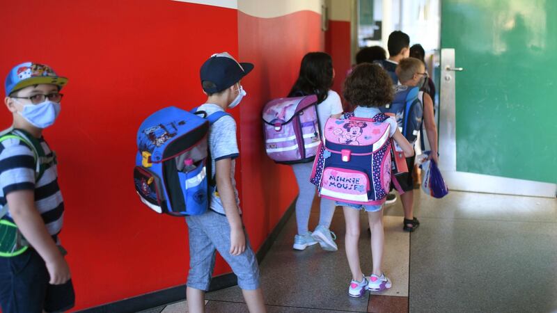 Students with face masks enter their classroom at the Petri primary school in Dortmund,  Germany. Face masks are not required in Irish primary schools. Photograph: Ina Fassbender/AFP