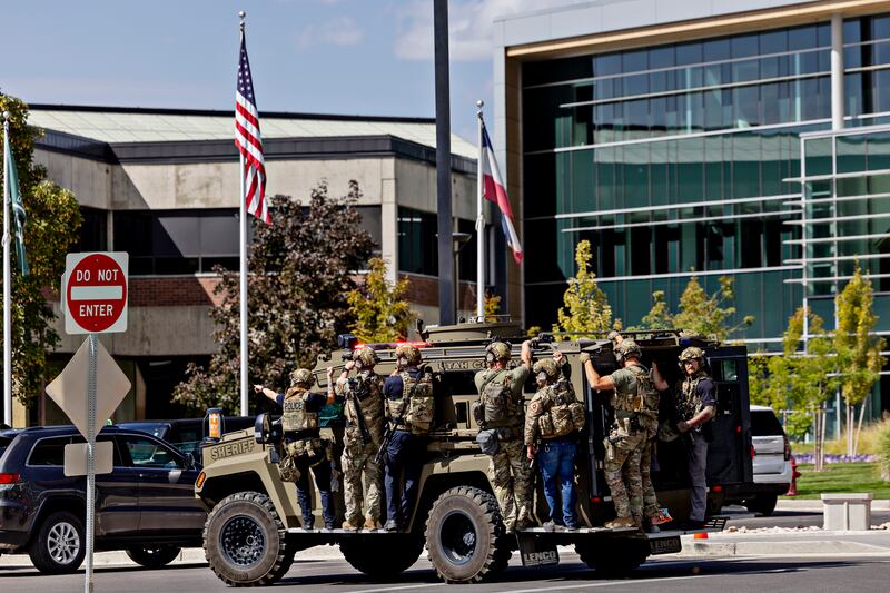 Law enforcement officers patrol on an armoured vehicle at the campus of Utah Valley University, where Charlie Kirk was fatally shot. Photograph: Kim Raff/The New York Times
                      