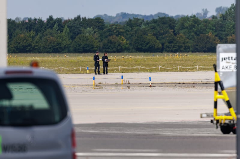 Police investigators work on the tarmac near a Ukrainian Antonov cargo plane. Photograph: Jens Schlueter/Getty Images