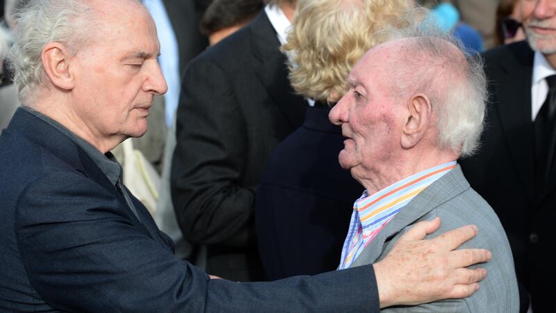 Seamus Deane and Brian Friel at the funeral of Seamus Heaney, in Bellaghy, Co Derry in 2013. Photographer: Dara Mac Dónaill