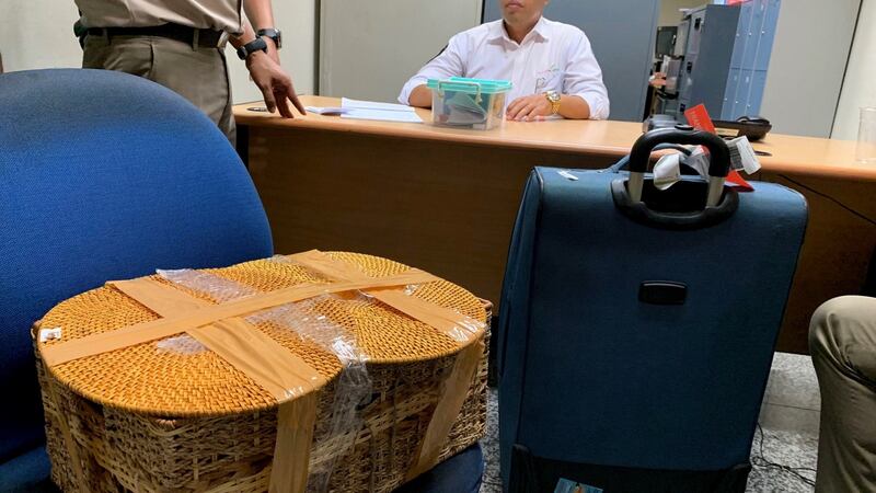 The belongings of Russian national Andrei Zhestkov are seen in a room following his arrest at an airport in Bali, Indonesia. Photograph: BKSDA Bali via AP