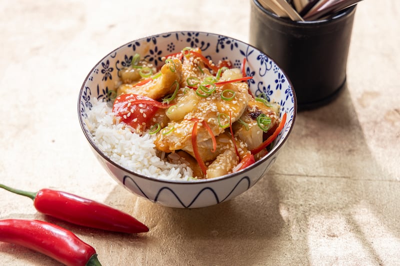 Sweet and sour chicken with rice. Photograph: Harry Weir