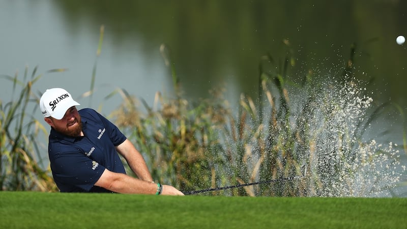 Lowry plays out of a bunker on the 14th. Photo: Matthew Lewis/Getty Images