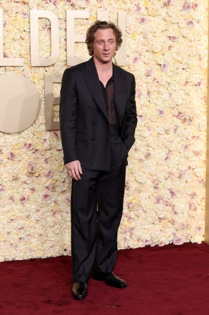 Jeremy Allen White wore a wide-lapel Calvin Klein suit over a sheer shirt. Photograph: Amy Sussman/Getty Images