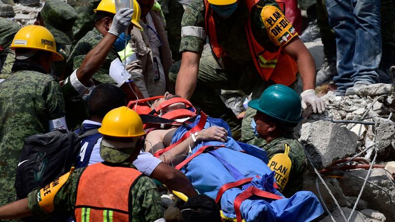 A man is pulled out of the rubble alive in Mexico City on Wednesday.  Photograph: Mario Vazquez/AFP