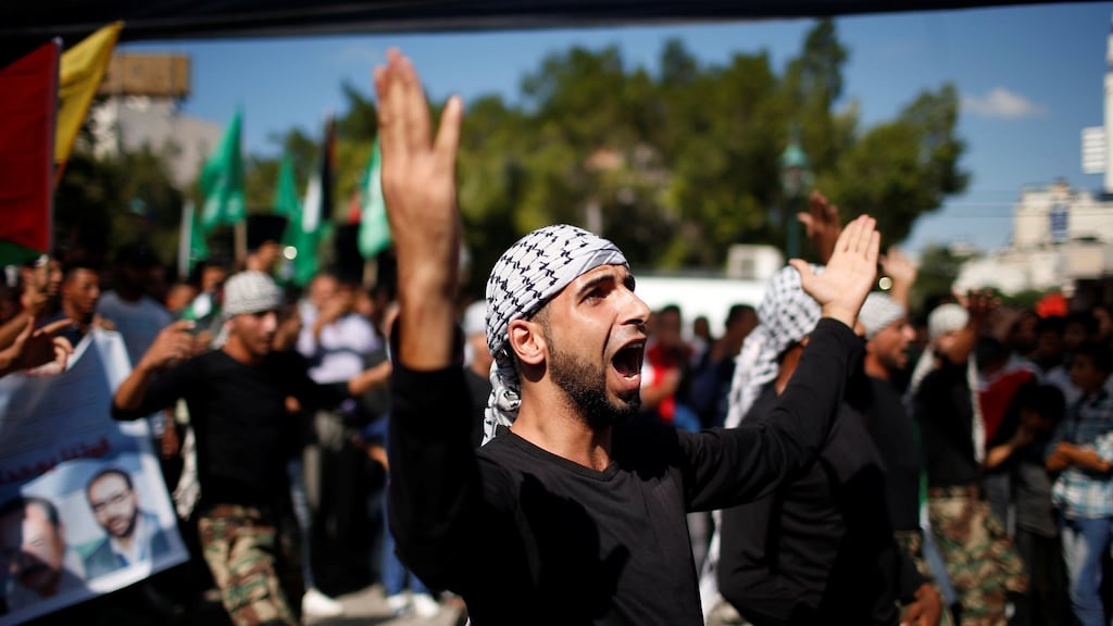 Palestinians celebrate after Hamas said it had reached a deal with Palestinian rival Fatah, in Gaza City on Thursday. Photograph:  Suhaib Salem/Reuters