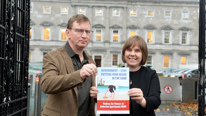 Andrew Prior and Kath Cottier from the Construction Defects Alliance outside Leinster House. Photograph: Dara Mac Dónaill/The Irish Times