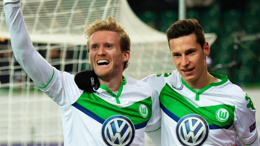 Wolfsburg’s Andre Schuerrle celebrates with his teammate Julian Draxler after scoring. Photograph: EPA