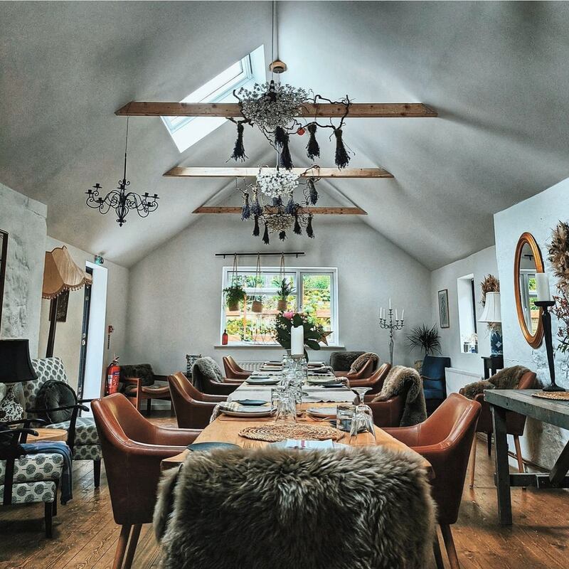One part of the old cottage is a large indoor dining space