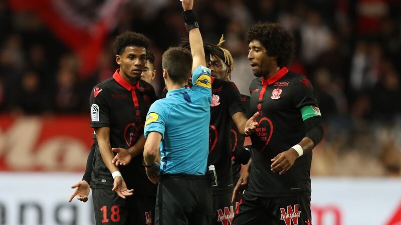 French referee Benoît Bastien  gives a red card to Nice’s French forward Ihsan Sacko  during the  Ligue 1  match between Monaco  and Nice  at the Stade Louis II  in Monaco. Photograph: Valery Hache/AFP/Getty Images
