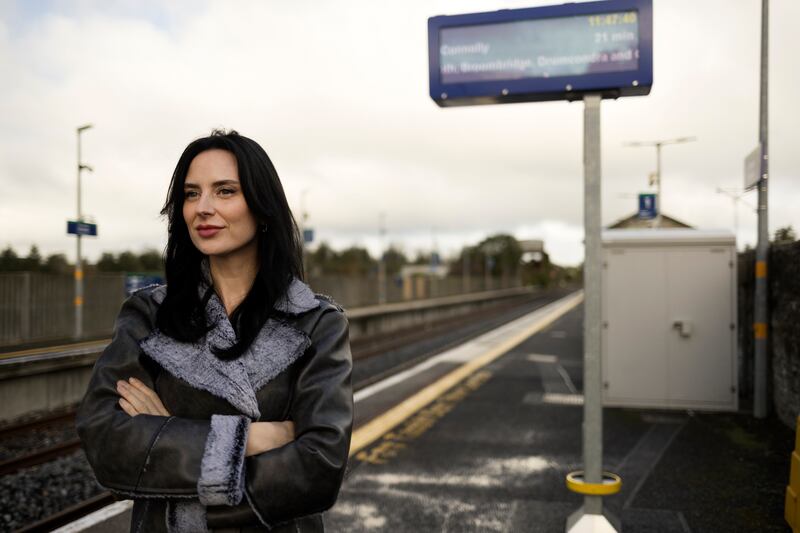 Martha Gilheaney waiting on the platform at one of Co Leitrim's two train stops. Photograph: Chris Maddaloni
