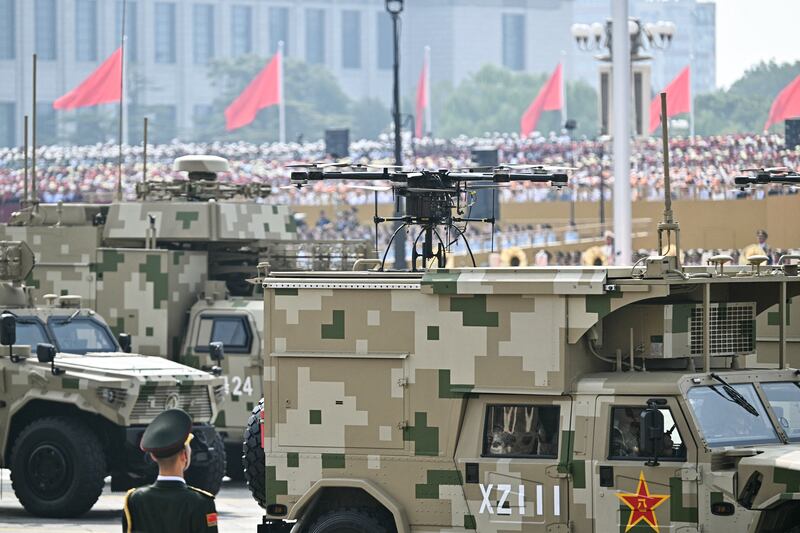 Military vehicles carrying drones are seen during the parade in Beijing's Tiananmen Square. Photograph: Pedro Pardo/ AFP via Getty Images  