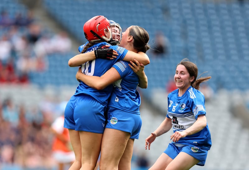 Laois' Grainne Delaney, Aimee Collier and Kirsten Keenan celebrate after the final whistle. Photograph: Bryan Keane/Inpho