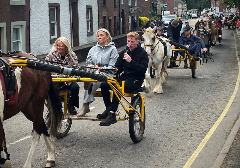 A procession of carts go through Appleby village. Photograph: Mark Paul