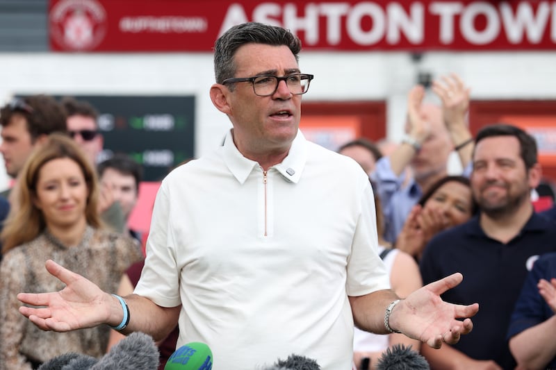 Andy Burnham celebrating his victory at Ashton Town Football Club in Makerfield, England. Photograph: Christopher Furlong/Getty Images)
