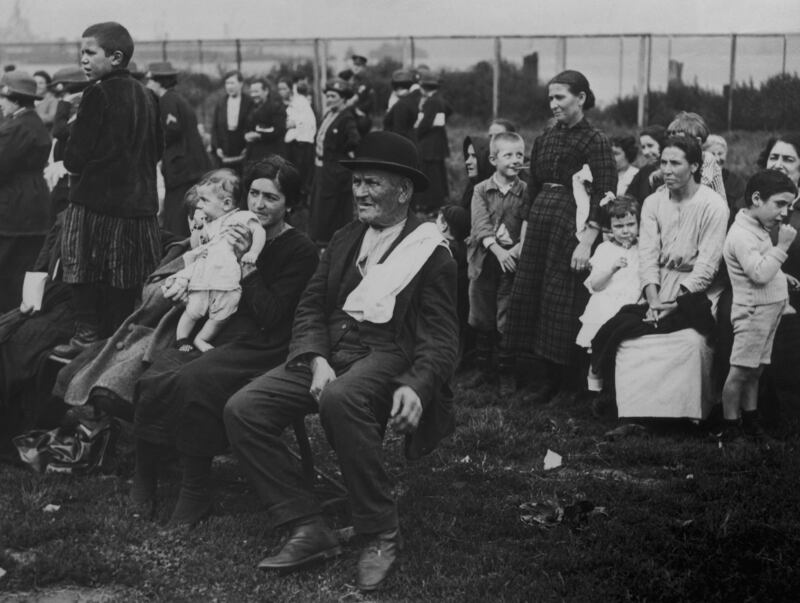 Immigrants to the US on Ellis Island, New York, circa 1920. The man in the bowler hat is Irish. Photograph: Getty Images