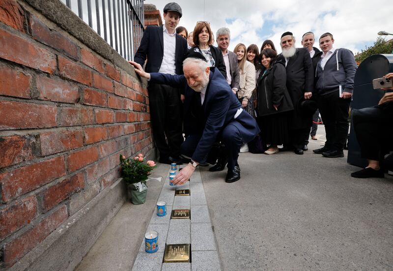 Joseph Schleider, nephew of Ettie Gluck (nee  Steinberg) who went to school at St Catherine’s National School, Dublin 8 and died at Auschwitz, with members of her extended family at the Stolpersteine ‘stumbling stones’ which were installed at the school by Holocaust Education Ireland. Photograph: Alan Betson / The Irish Times