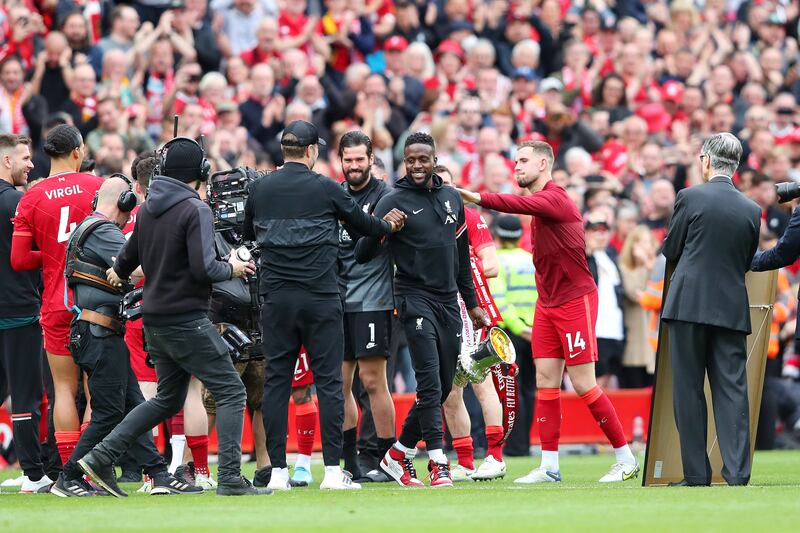 Divock Origi is given a guard of honour by his Liverpool teammates and management team after the final Premier League match of the season at Anfield. Photograph: Alex Livesey/Getty Images