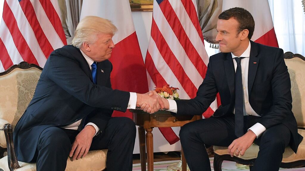 US president Donald Trump and French President Emmanuel Macron shake hands at the US ambassador’s residence in Brussels in May 2017. Photograph: Mandel Ngan/AFP/Getty Images