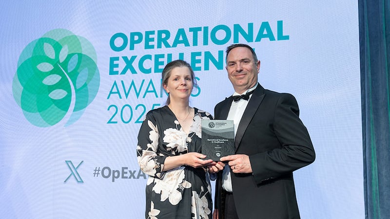 Elaine Wall, quality manager, ISS Ireland, presents the operational excellence in healthcare award to Liam Curran, Sláintedoc