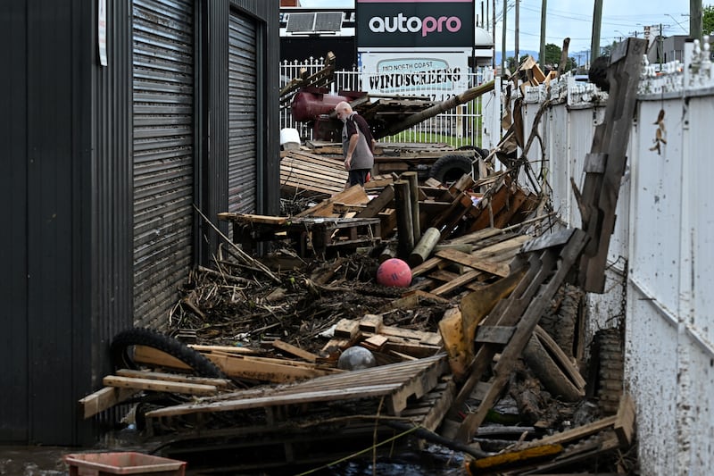 Australia floods: waterlogged motorcycle showroom. Photograph: Seaeed Khan/AFP/ Getty Images