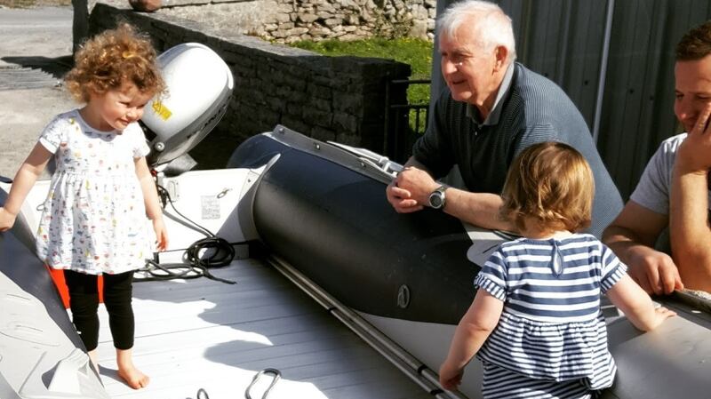 Maeve and  Claire O’Halloran with dadó Máirtín and their dad David on Inis Mór